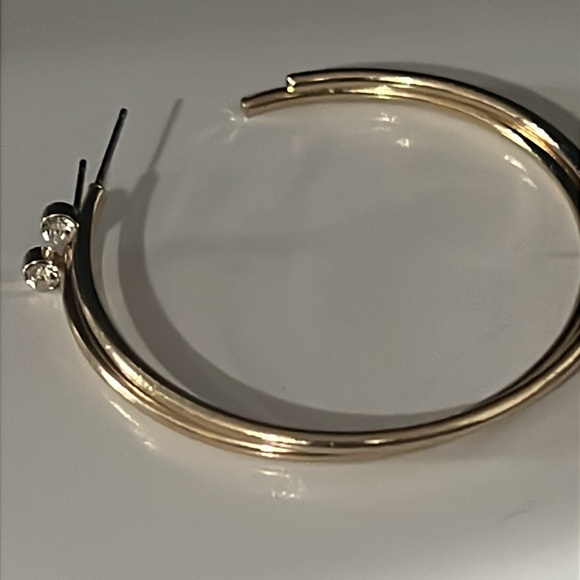 Gold tone hoop earrings with beautiful crystal accent at the top of the earrings - Picture 2 of 4